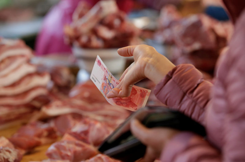China's consumer inflation at eight-year high, but PPI stuck in the red