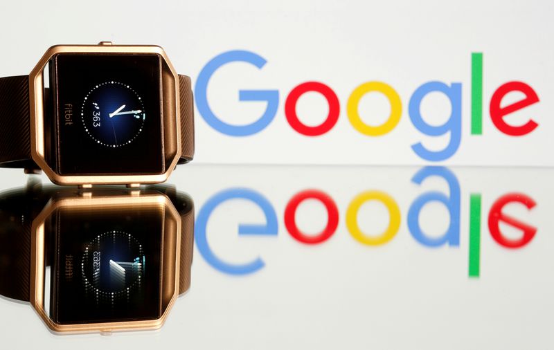 © Reuters. FILE PHOTO: Fitbit Blaze watch is seen in front of a displayed Google logo in this illustration