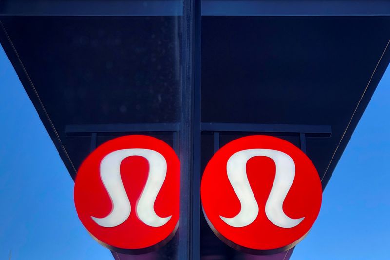 © Reuters. FILE PHOTO: A sign for a Lululemon retail shop is reflected in the store's window at a shopping mall in San Diego