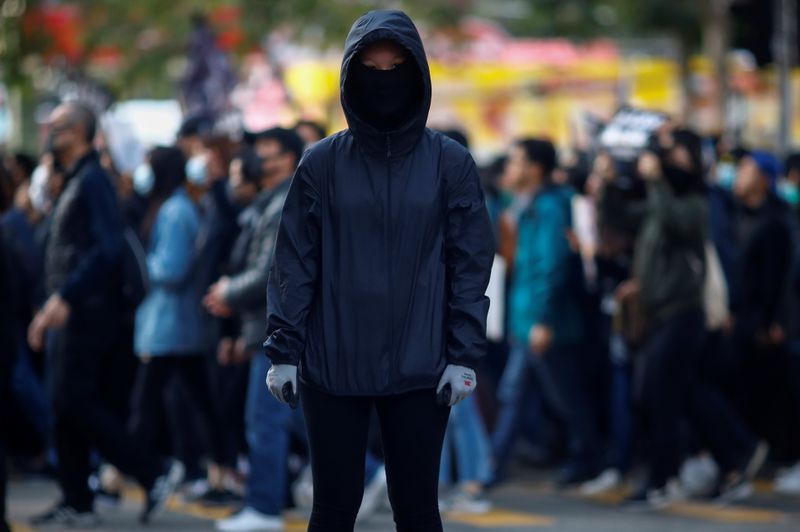 © Reuters. Anti-government protester Fiona poses for a picture during a march organised by the Civil Human Rights Front in Hong Kong