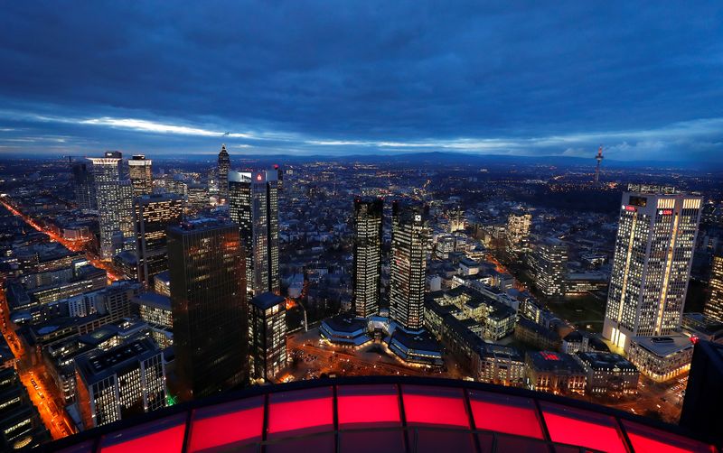 © Reuters. The financial district with the headquarters of Germany's largest business bank, Deutsche Bank (C), is photographed on early evening in Frankfurt