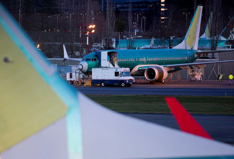 © Reuters. A service truck is seen stopped next to a Boeing 737 Max aircraft in storage at the Renton Municipal Airport in Renton