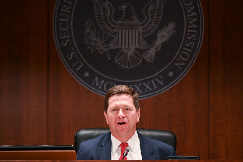 © Reuters. Chairman Clayton participates in a U.S Securities and Exchange Commission open meeting to propose changing its definition of an "accredited investor" in Washington