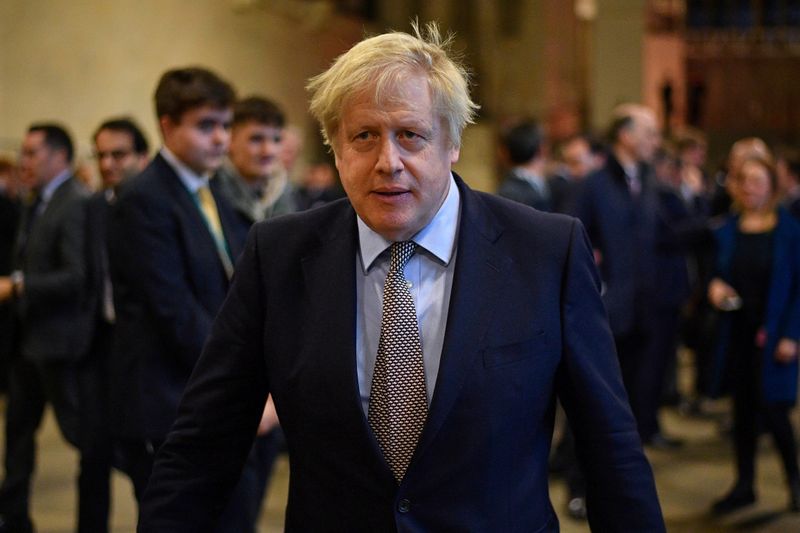 © Reuters. FILE PHOTO: British Prime Minister Boris Johnson greets newly-elected Conservative MPs at the Houses of Parliament, London