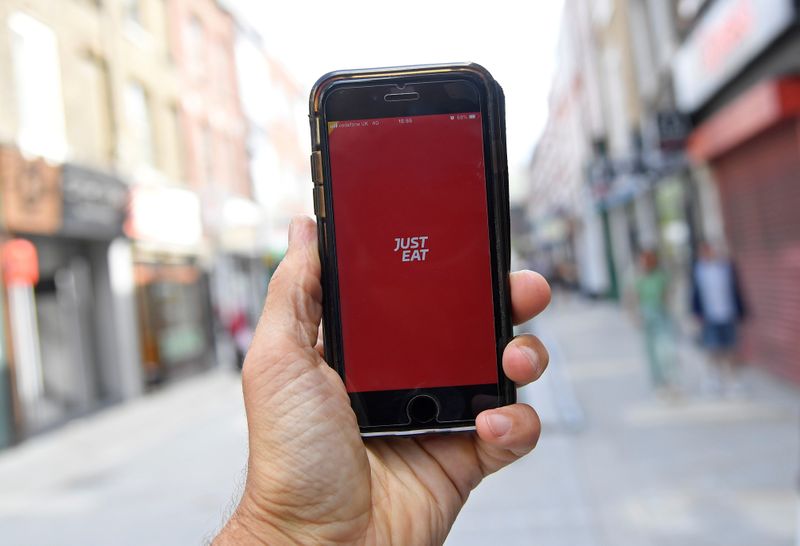 © Reuters. FILE PHOTO: The app for Just Eat is displayed on a smartphone, in London