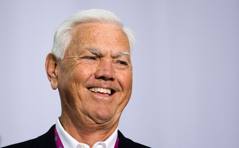 © Reuters. NASCAR Hall of Fame inductee Junior Johnson smiles while speaking during the grand opening of the NASCAR Hall of Fame in Charlotte