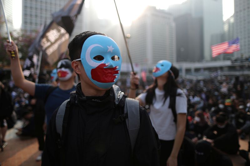 © Reuters. Hong Kong protesters rally in support of Xinjiang Uighurs' human rights in Hong Kong