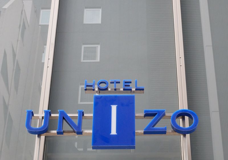 © Reuters. FILE PHOTO: The logo of Hotel Unizo, operated by Japanese hotel operator Unizo Holdings, is seen at the entrance of the hotel in Tokyo, Japan