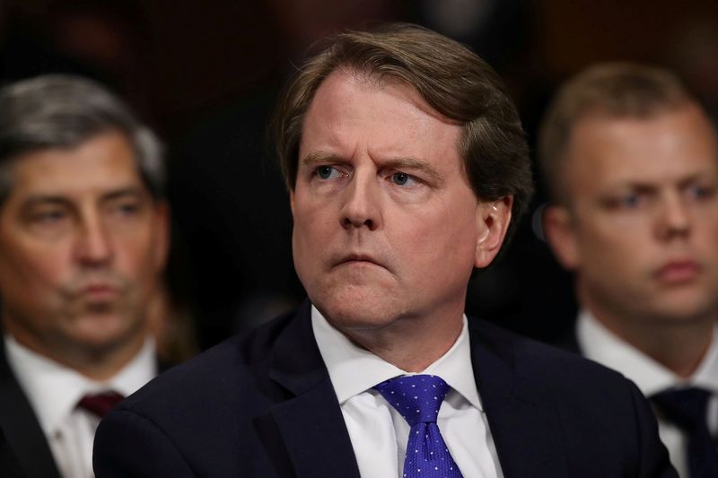 © Reuters. FILE PHOTO: White House Counsel Don McGahn listens to Judge Brett Kavanaugh as he testifies before the Senate Judiciary Committee during his Supreme Court confirmation hearing in the Dirksen Senate Office Building on Capitol Hill