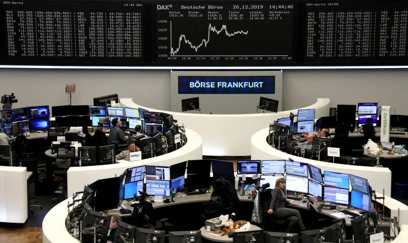 European shares hover near record high in thin holiday trade