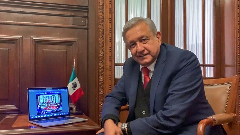 © Reuters. Mexico's President Andres Manuel Lopez Obrador celebrates the U.S. House approval of the USMCA North American trade deal at the National Palace in Mexico City