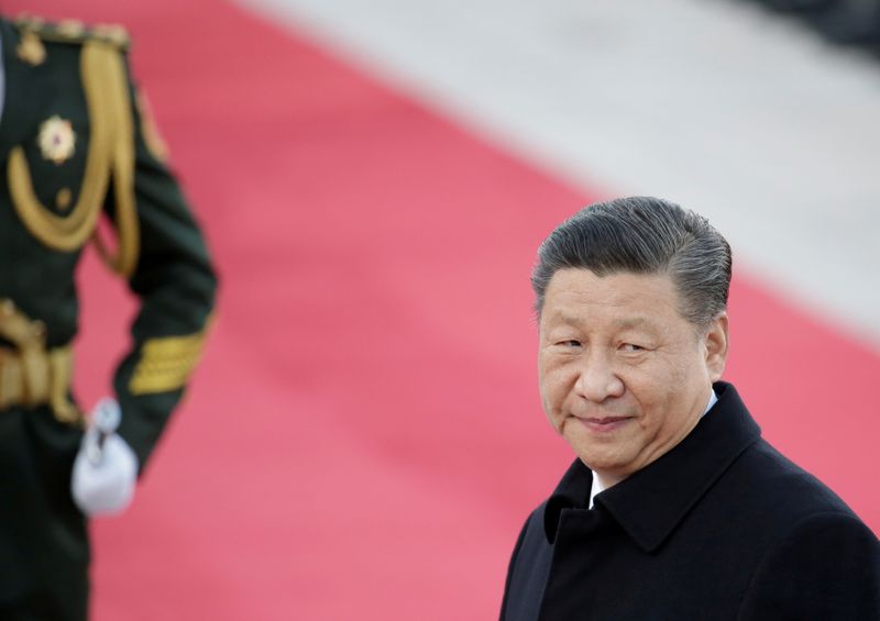 China's Xi turns to financial experts to tame economic risks