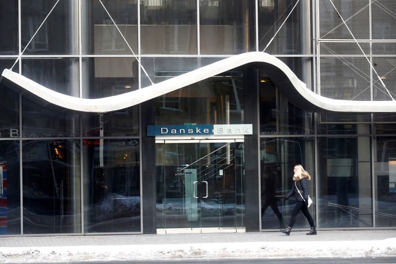 © Reuters. FILE PHOTO: A woman walks past Danske Bank's Estonian branch in Tallinn