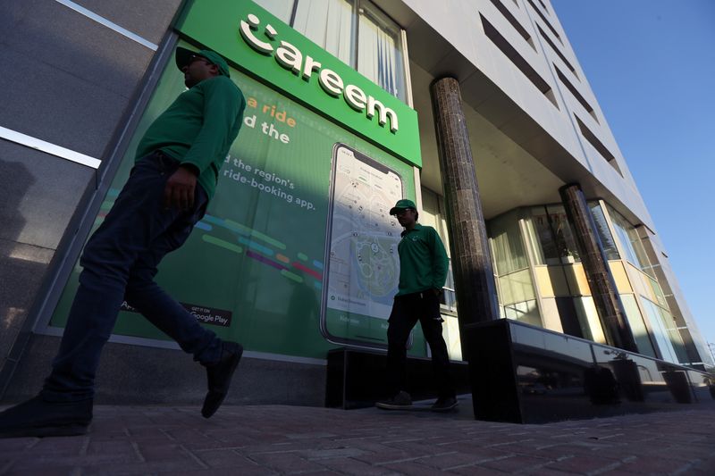 © Reuters. FILE PHOTO: Careem employees walk past the company's headquarters in Dubai, UAE