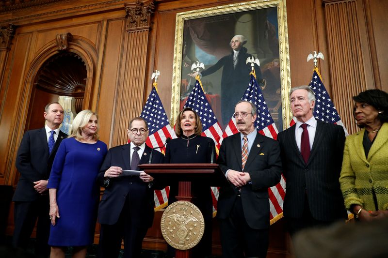 © Reuters. U.S. Speaker of the House Nancy Pelosi speaks to the media after voting on impeachment of U.S. President Trump