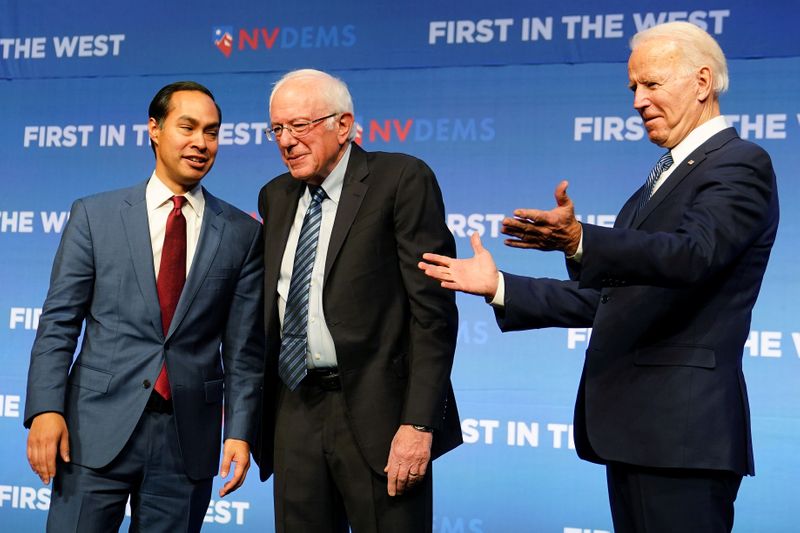 © Reuters. FILE PHOTO: Julian Castro, Bernie Sanders and Joe Biden stand on stage at a First in the West Event at the Bellagio Hotel in Las Vegas