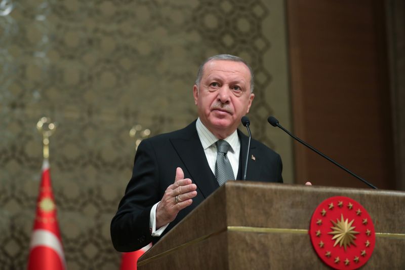 © Reuters. Turkish President Erdogan speaks during a symposium in Ankara