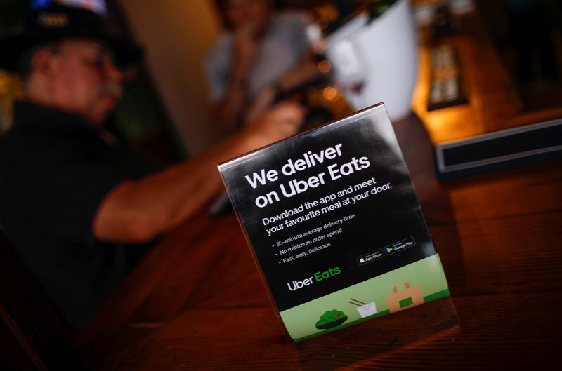 © Reuters. A flyer advertising Uber Eats delivery service is pictured at a restaurant in Cape Town