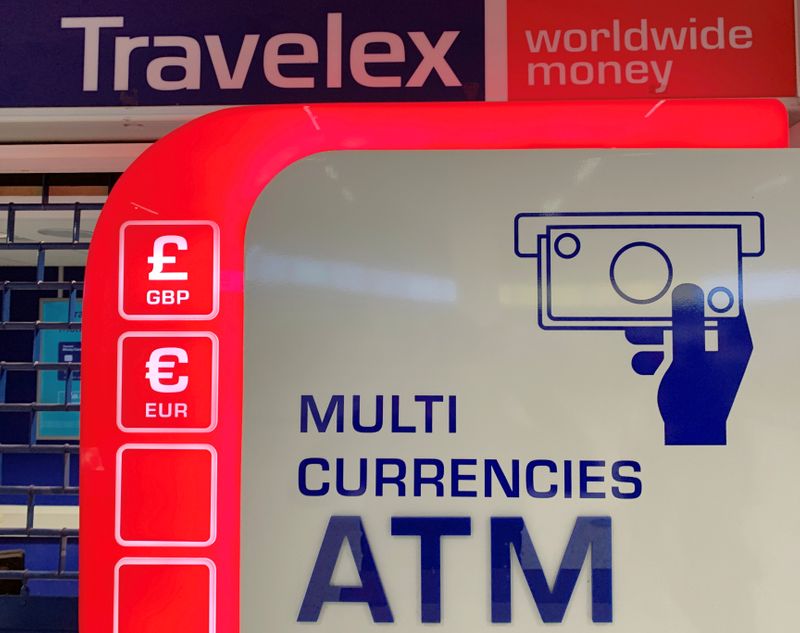 © Reuters. Signage is seen above a Travelex ATM at Manchester Airport in Manchester