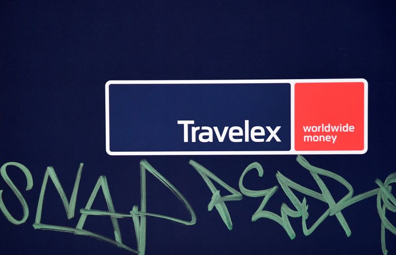 © Reuters. Signage with graffiti next to it is seen on a branch of Travelex Currency Exchange in London