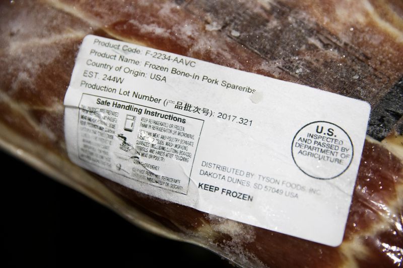 © Reuters. FILE PHOTO: A label shows the origin of frozen pork that was imported from the U.S. at the Beijing barbeque restaurant Home Plate that specializes in U.S. meat