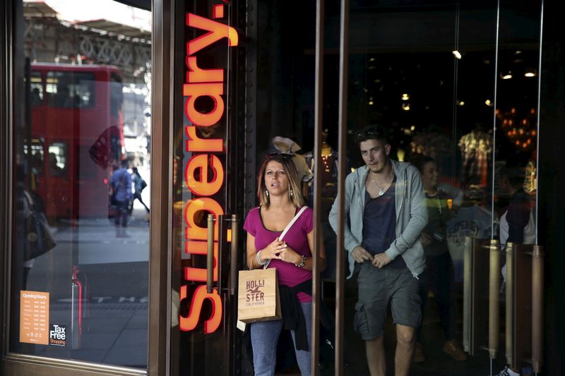 © Reuters. People leave a Superdry store in central London