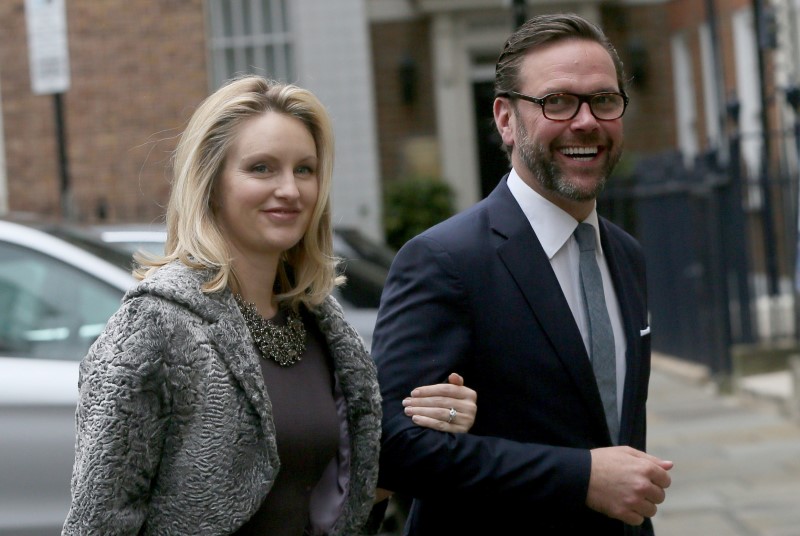 © Reuters. FILE PHOTO: James Murdoch, the son of media mogul Rupert Murdoch, and his wife Kathryn Hufschmid arrive for a reception to celebrate the wedding between Rupert Murdoch and former supermodel Jerry Hall which took place in 2016 in London