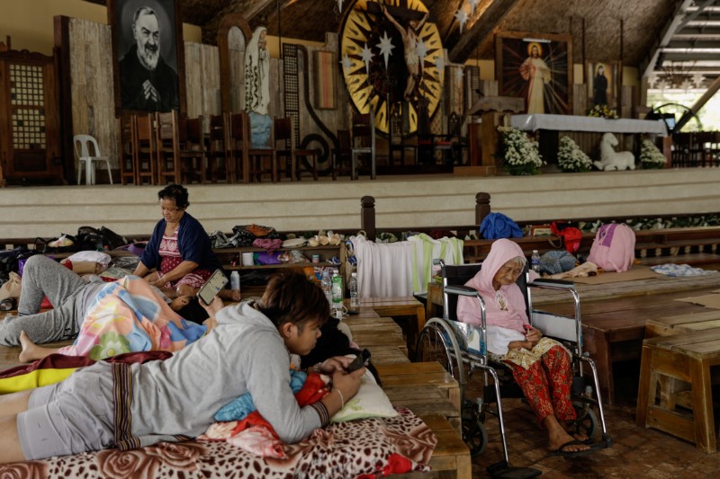 © Reuters. Residents affected by the Taal Volcano eruption rest in Padre Pio Shrine