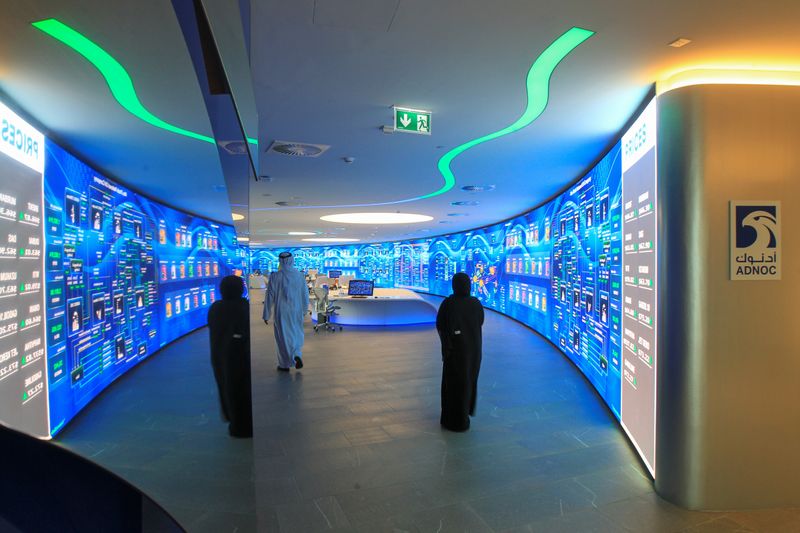 © Reuters. Employees are seen at the Panorama Digital Command Centre at the ADNOC headquarters in Abu Dhabi