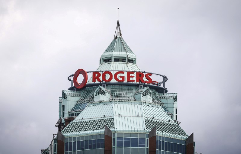 © Reuters. FILE PHOTO: A sign is pictured on top of the Rogers Communications Inc. building on the day of their annual general meeting for shareholders in Toronto