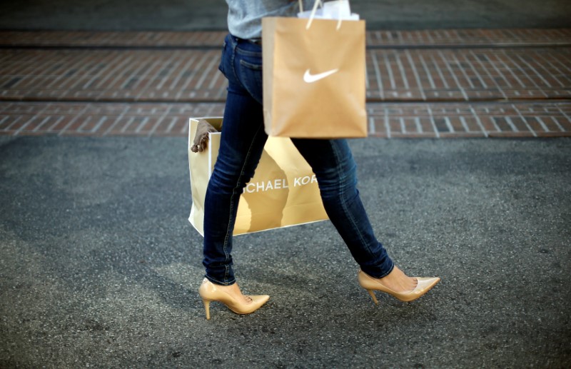 © Reuters. FILE PHOTO: Woman shops at The Grove mall in Los Angeles