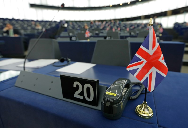 © Reuters. FILE PHOTO: A British Union Jack flag is seen on the desk of Farage, leader of the UKIP and MEP, ahead of a debate at the European Parliament in Strasbourg
