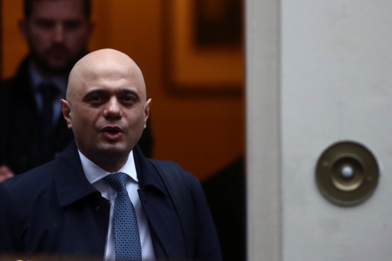 © Reuters. FILE PHOTO:  Britain's Chancellor of the Exchequer Sajid Javid walks at Downing Street in London
