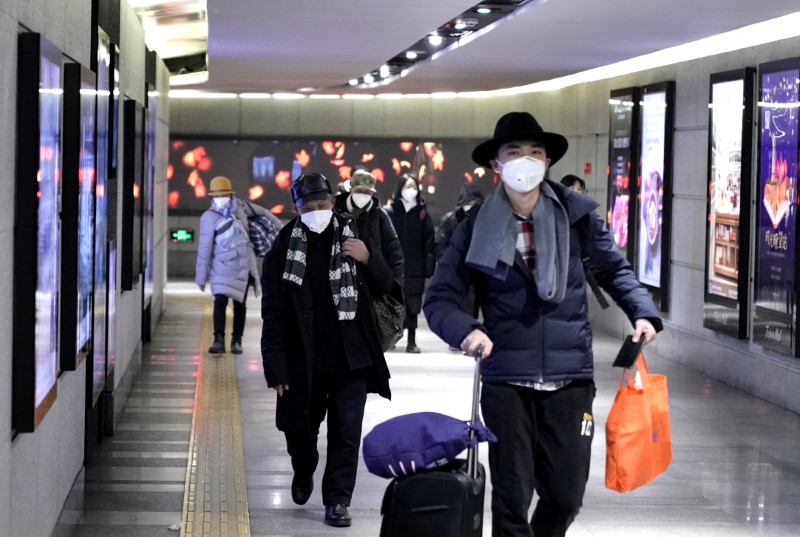 China companies issue staff with masks, travel warnings as virus outbreak fears grow