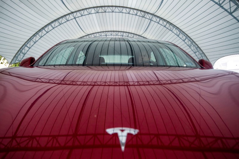 Tesla races past $100 billion in market valuation