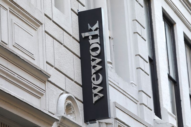 © Reuters. A sign is seen above the entrance to the WeWork corporate headquarters in Manhattan, New York