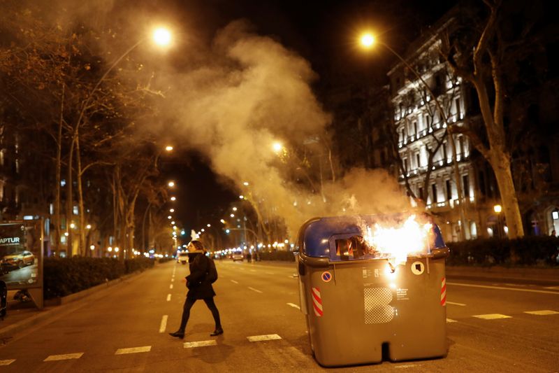 Catalan leader stripped of lawmaker rights, protesters scuffle with police