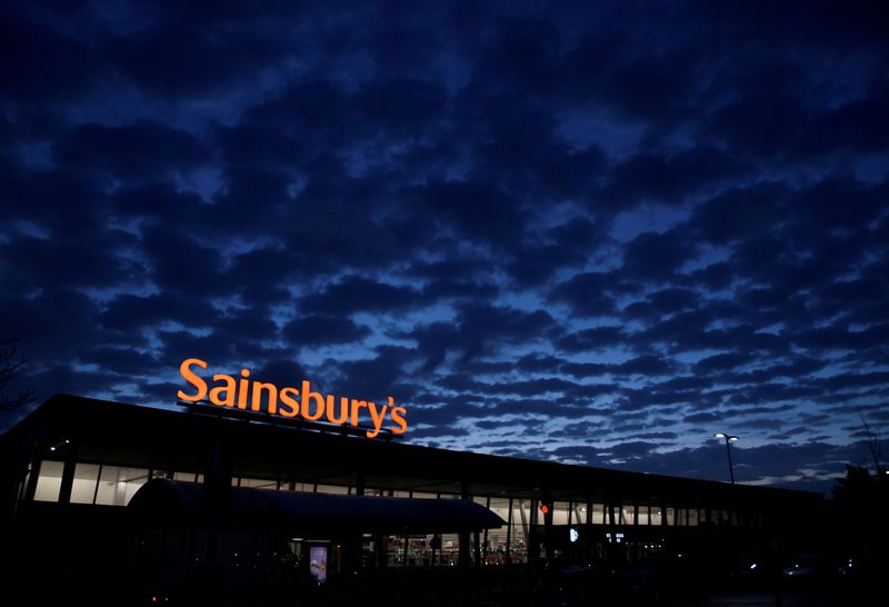 © Reuters. FILE PHOTO: Signage for Sainsbury's is seen at a branch of the supermarket in London