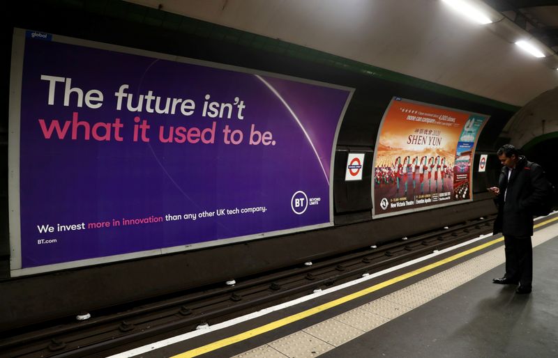 © Reuters. FILE PHOTO: British Telecom (BT) advertisement is displayed at Goodge Street underground station in London