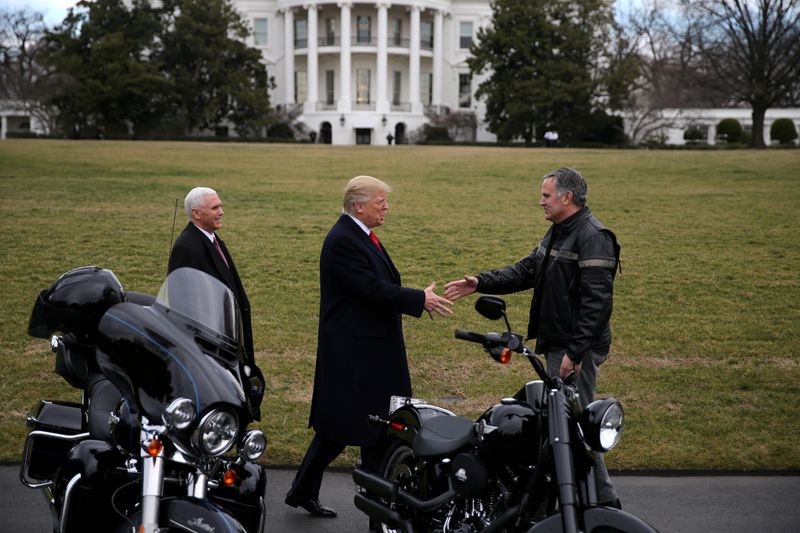 © Reuters. FILE PHOTO: U.S. President Donald Trump shakes hands with Matthew S Levatich, CEO of Harley Davidson at the White House