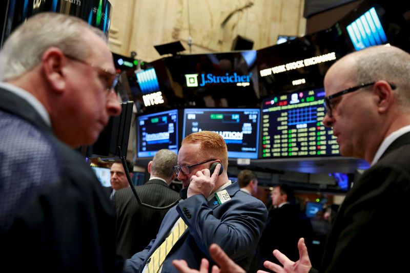 © Reuters. File photo of traders working on the floor of the New York Stock Exchange shortly after the opening bell in New York