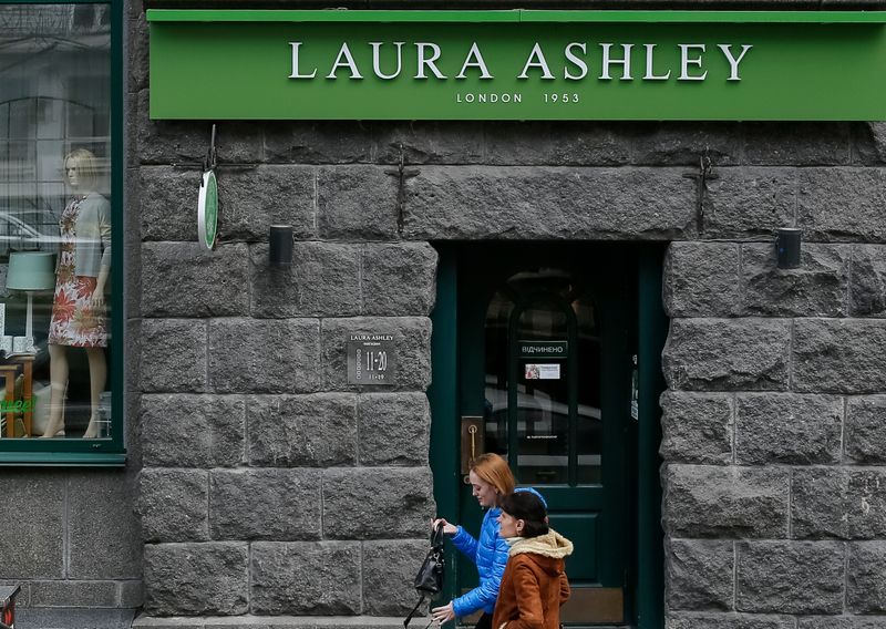 © Reuters. People walk past Laura Ashley store in Kiev