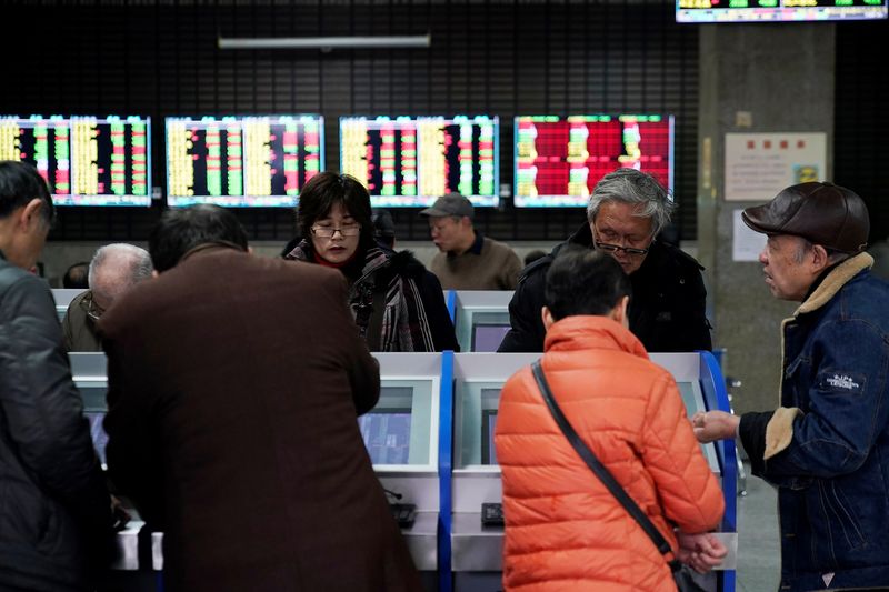 Asian shares drop, commodities sink on virus fears after Lunar New Year break
