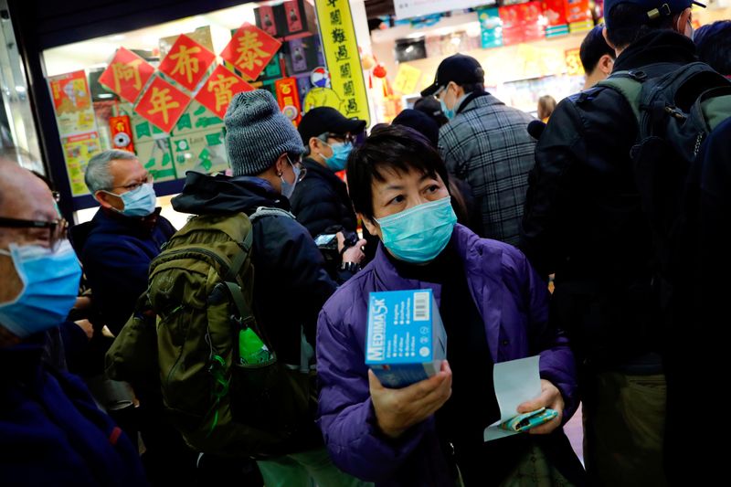 'Busy looking for masks': Financiers worry about virus, Hong Kong braces for business slowdown