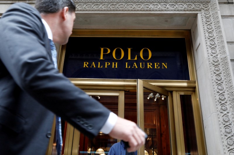 © Reuters. FILE PHOTO: A man walks past Ralph Lauren Corp.'s  flagship Polo store on Fifth Avenue in New York