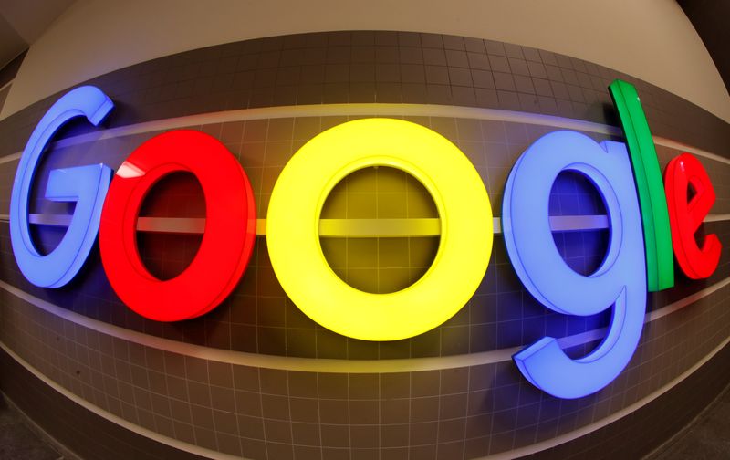 © Reuters. FILE PHOTO: An illuminated Google logo inside an office building in Zurich