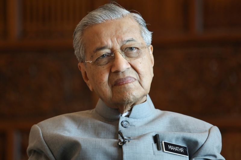© Reuters. Malaysia's Prime Minister Mahathir Mohamad looks on during an interview with Reuters in Putrajaya