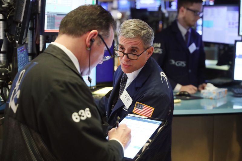 © Reuters. Traders work on the floor of the New York Stock Exchange shortly after the opening bell in New York