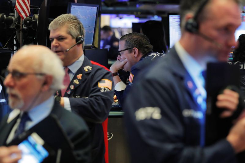 © Reuters. Traders work on the floor of the New York Stock Exchange shortly after the opening bell in New York