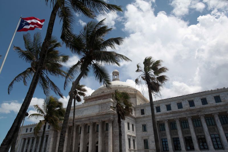 © Reuters. FILE PHOTO: The flag of Puerto Rico flies outside the Capitol building in San Juan